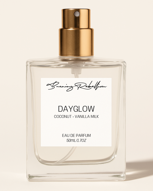 Perfume bottle labeled 'Dayglow' by Running Rebelhorn on a beige background