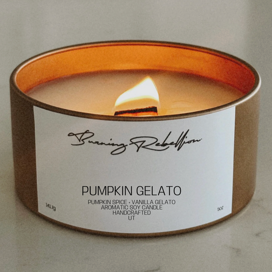 Candle labeled 'Pumpkin Gelato' by Banning Rebellion on a neutral background